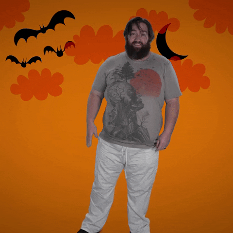 Video gif. A big, awkward man waves at us, then looks behind at the Halloweeny background, double takes, then cringes nervously and walks out.