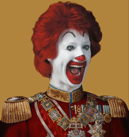 Video gif. Slightly creepy animated portrait photo of Ronald McDonald, a red haired, white faced clown, raising his eyebrows and open mouth smiling. His head bobbles to one side as his arms raise to give two large thumbs up.