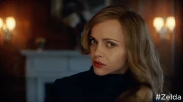 woman angrily chopping off her hair