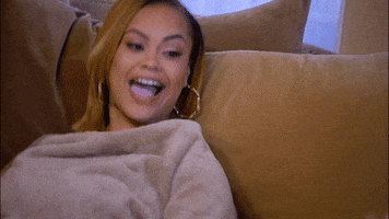 Reality TV gif. Crystal Westbrooks in the Westbrooks leans forward and laughs hysterically. 