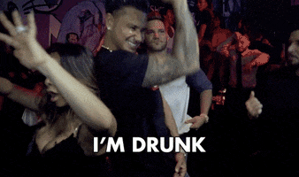 TV gif. In a crowded nightclub, a grinning Pauly D from Jersey Shore Family Vacation pumps his arm as if pulling a truck horn, then puts a hand to his chest for a confession: Text, "I'm drunk."