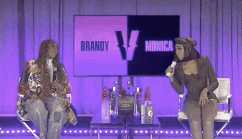 Celebrity gif. From Verzuz, Brandy looks over and says, "You're beautiful, Monica," and Monica replies, "well, thank you."