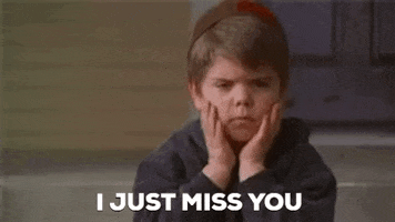 Movie gif. Travis Tedford as Spanky from The Little Rascals sits on porch steps, resting his chin on his hands. His expression changes from grumpy to forlorn. Text, "I just miss you."