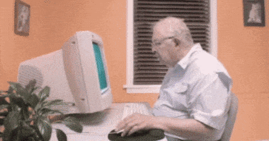 Video gif. An old man sits at an old Windows computer, and we see on screen as he clicks on "My Computer" and drags it into the trash can. The computer disappears from his desk, and he looks behind him, saying, "Linda..."