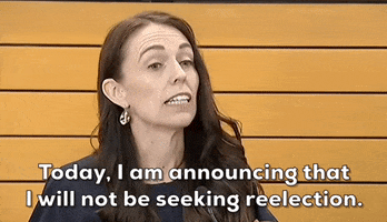 Video gif. Jacinda Ardern stands in front of a microphone in the New Zealand parliament. She looks down to read her notes and then up at us as she speaks passionately. "Today, I am announcing that I will not be seeking reelection." 