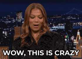 Celebrity gif. Queen Latifah, as a guest on the Tonight Show, glances down and half-smiles while she says "Wow, this is crazy," which appears as text.