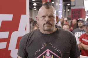 Sports gif. UFC fighter Chuck "The Iceman" Liddell points a stern finger at us.