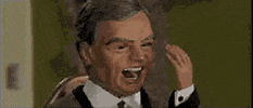 TV gif. From Thunderbirds, several business-men puppets appear to laugh, reeling back with open mouths, unsettlingly.