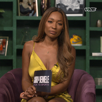 Reality TV gif. Cari Champion on Stick to Sports holds cue cards in her hand as she rests it on her leg. She looks around suspiciously and bites her inner cheek to stop herself from saying something she maybe can’t say.