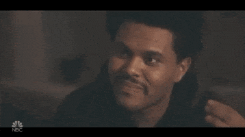 Celebrity gif. The Weeknd rolls his eyes and uncomfortably looks away as if he doesn't approve.