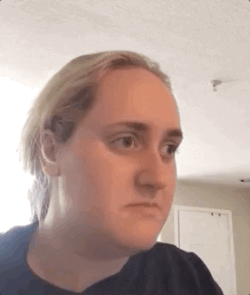 Video gif. Tiktoker Brittany Broski cringing in disgust after taking a sip of Kombucha, contorting her face into a big frown. She quickly changes her tune as she thinks for a moment, then she goes back to being disappointed saying, “no, no,” and then thinks again about the taste. She tilts her head and chuckles, saying, “well…”