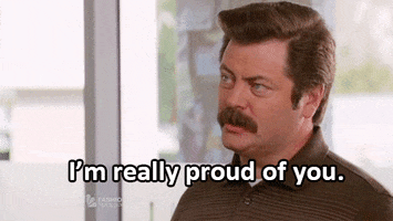 TV gif. Nick Offerman as Ron in Parks and Recreation beams at someone and smiles under a thick mustache. Text, "I'm really proud of you."