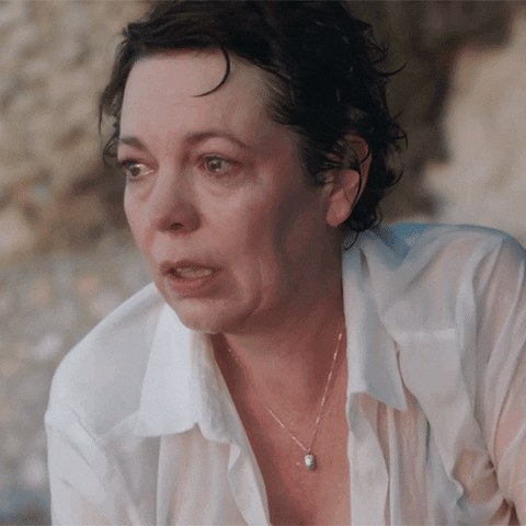 Movie gif. Olivia Colman as Leda in The Lost Daughter. She's crying and her eyes are red and puffy as she looks forward.