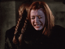 TV gif. Alyson Hannigan as Willow in Buffy the Vampire Slayer. She's sobbing into Buffy's arms and we see her face crying and streaked with tears.