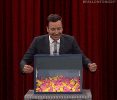 Tonight Show gif. Jimmy Fallon reaching blindly into a box full of pink and yellow bunny Peeps. Text, "I'm freaking out right now!"
