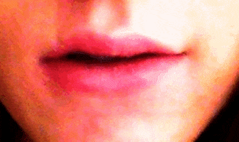 lip biting smile GIF