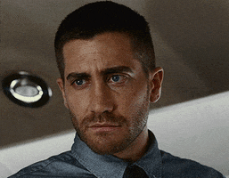 Movie gif. Jake Gyllenhaal as Colter Stevens in Source Code looks skeptically, gently but firmly cringing and shaking his head no.