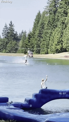 Barefoot Waterskier Hangs From Low Flying Helicopter GIF by ViralHog