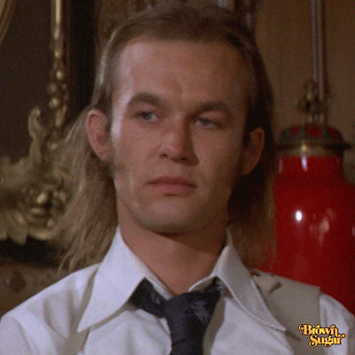 Movie gif. Blond-haired guy in "Cleopatra Jones" looks blank and rolls his eyes.