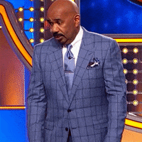 Reality TV gif. Steve Harvey on Family Feud stumbles with a shocked expression on his face. He then starts laughing loudly. 