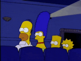 The Simpsons gif. In a movie theater, Homer, Marge, Bart, and Lisa look over to the side, and then Homer turns back and shrugs.