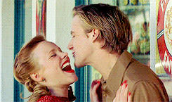 Movie gif. Ryan Gosling and Rachel McAdams as Noah Calhoun and Allie Hamilton in The Notebook share an adorable, happy moment as Allie playfully dodges Noah's kisses but ends up showering him with smooches.