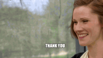Reality TV gif. Cathryn Dresser on Great British Baking Show smiles wide and says "thank you, thank you," which appears as text.