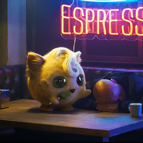 Pokemon gif. Jigglypuff in Detective Pikachu holds a microphone as it turns and glares angrily.