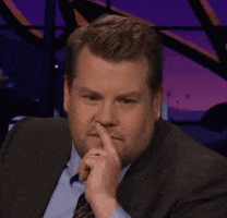 Celebrity gif. James Corden puts his hand to his chin, as if deep in thought.