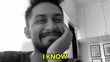 Video gif. Influencer Digital Pratik squints his eyes and nods his head while saying, “I know.”