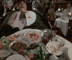 Movie gif. Covered in food, Terry Jones as Mr. Creosote from Monty Python's The Meaning of Life blows up like a balloon, knocking over his dinner table...and we cut away as he splatters all over the restaurant.