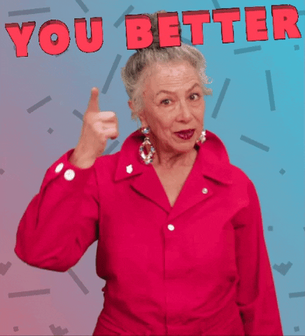 Video gif. An older woman looks at us expectantly while pointing at her forehead to indicate thinking. The text above her reads, "You better."