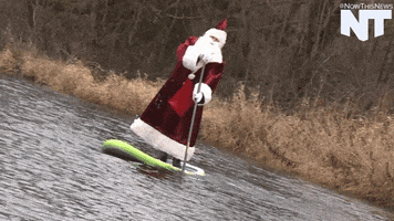 santa paddleboard GIF by NowThis 