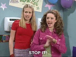 TV gif. Amanda Bynes on the Amanda Show waves her hands in protestation as she glances around as if in shock. Text, "Stop it!"