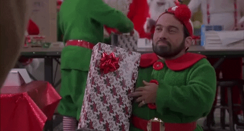 jingle all the way shrug GIF