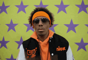 TV gif. Nick Cannon on Nickelodeon mimes removing a mask from his face as he dips back then walks off screen. 