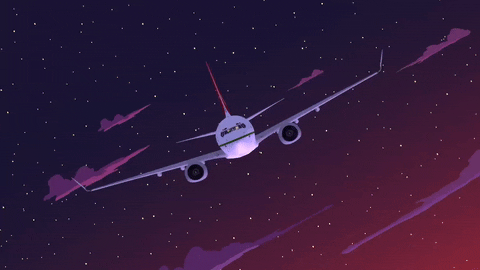 Airplane flying in dusky purple sky.