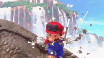 Video game gif. From "Super Mario Odyssey," Mario leaps into the air off of the side of a cliff in front of a mountain with hundreds of waterfalls, raising one fist in the air and looking triumphant.