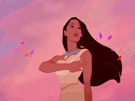 Disney gif. Pocahontas waves slowly, raising her arm in a full circle as she stands in front of a sunset. She smiles softly and nods her head with determination as leaves blow around her.