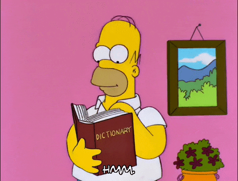Homer Simpson thoughtfully flipping through a dictionary, captioned with a curious "Hmm"