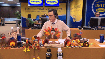 The Late Show gif. Stephen Colbert sitting in the Butterball Turkey offices, surrounded by Thanksgiving decor, hanging up a phone call. Text, "wrong answer bye bye." 