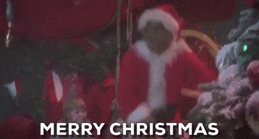 Movie gif. Jim Carrey as The Grinch dressed as Santa jumps up and spreads his arms wide. yelling what the text reads, "Merry Christmas!" 