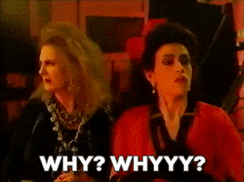 Movie gif. Claire Caplan and Karin Konoval as witches in Double Double Toil and Trouble look over shocked as they both word the text that appears, "Why? Why?"