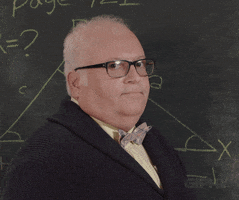 Video gif. A professor is standing in front of a chalkboard filled with mathematical equations and he gives us a thumbs up.