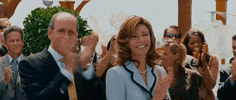 Movie gif. At the front of an applauding crowd, Mary Steenburgen as Nancy in Step Brothers claps her hands joyfully next to Richard Jenkins as Robert who smiles and claps.