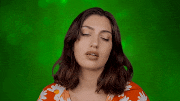 Video gif. Groggy woman with heavy eyes nods off, too tired to stay awake.