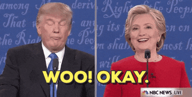 Political gif. Donald Trump and Hillary Clinton are in the 2016 presidential debates and both are trying to shake each other off. Clinton says, "Woo, okay," while grinning and shimmying and Trump does a closed lipped smile while closing his eyes then looking at her.