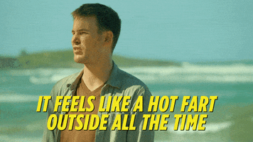 Movie gif. Zach Cregger as Owen in Wrecked stands on a beach and speaks emphatically, saying, "It feels like a hot fart outside all the time."