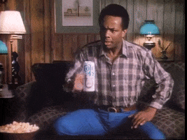 TV gif. In a retro scene from Soul Train, a perplexed man reaches out to grab a floating Colt 45 beer, and then he begins to float away, led by the beer.