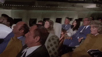 airplane movie dragging a body GIF
